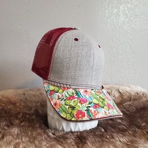 Ball cap with hand-sewn leather patch on brim